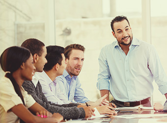 a diverse group of colleagues conversing during a meeting